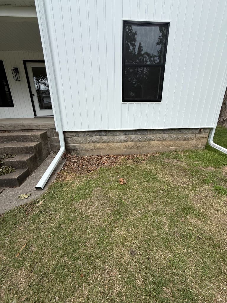 Weathered front foundation wall before coating.