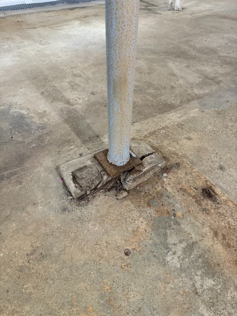 Bare concrete around a support column before coating.