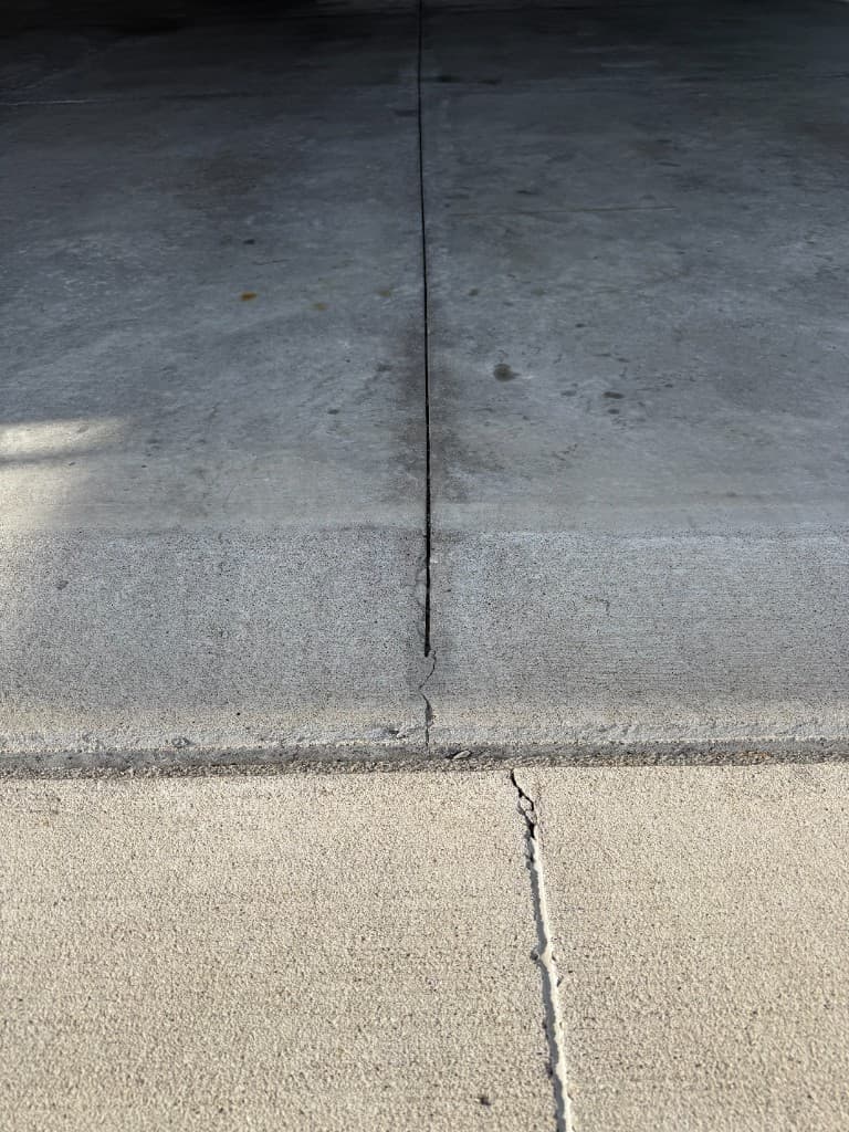 Garage door threshold edge before floor coating.