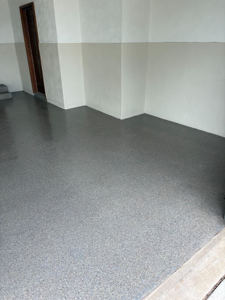 Finished Obsidian flake garage floor with two-tone walls.