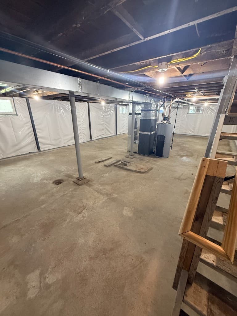 Bare basement concrete floor before coating.